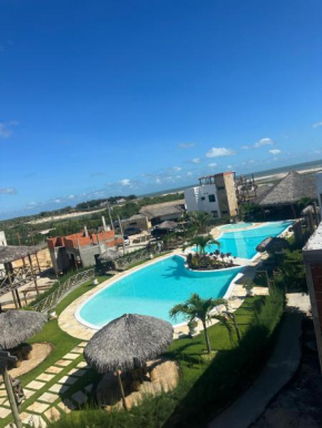 Chalé em condomínio beira mar